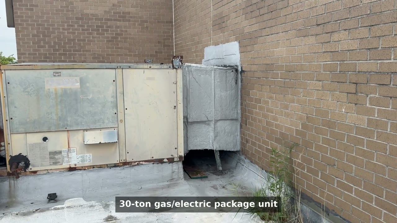 The 30-ton gas/electric rooftop package unit on the 1933 East Baltimore church, weathered and painted over