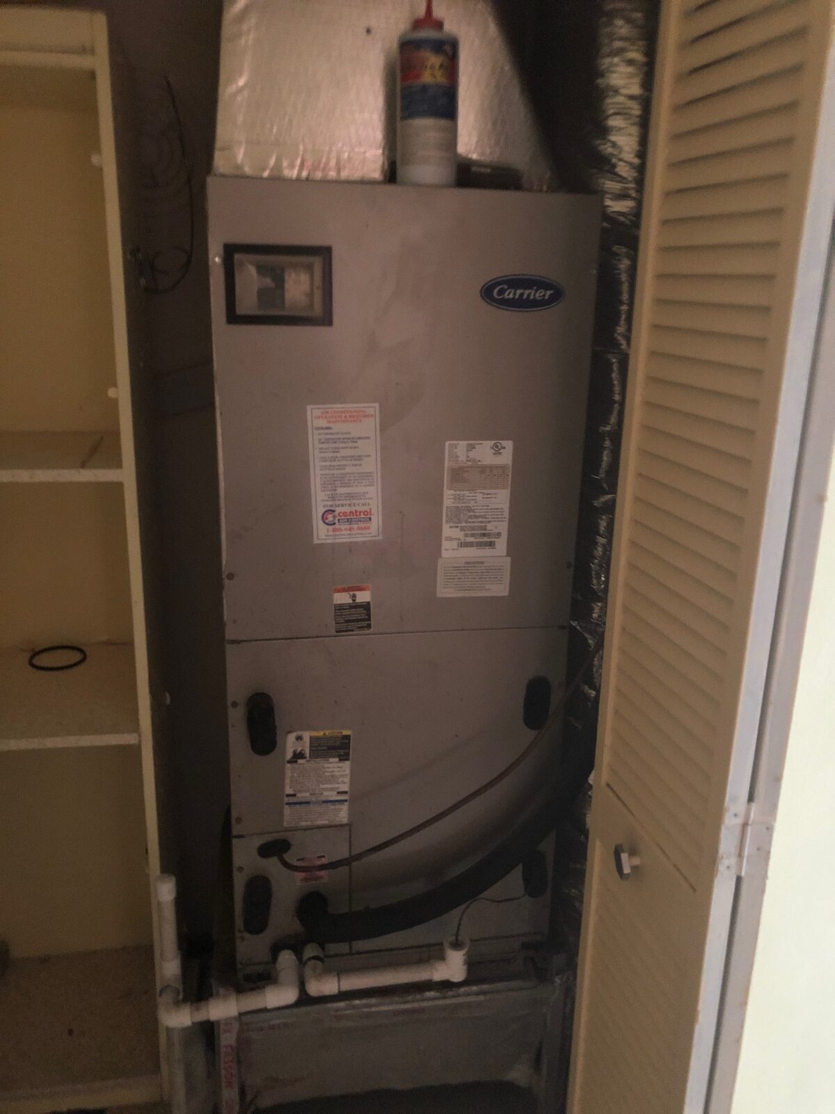 Indoor Carrier air handler installed inside a utility closet